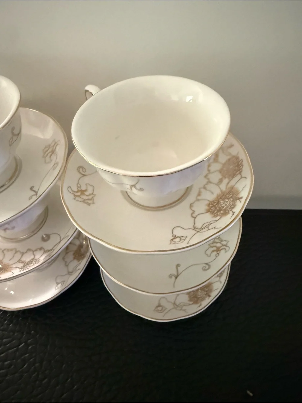 Set Of 6 cup and saucer feature the gold overglaze monogram White porcelain body